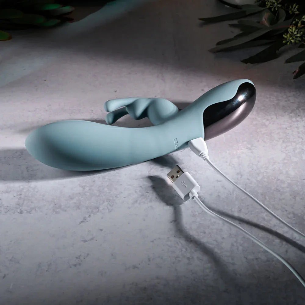 Evolved Boss Bunny in Baby Blue lying flat with its magnetic USB charging cable attached
