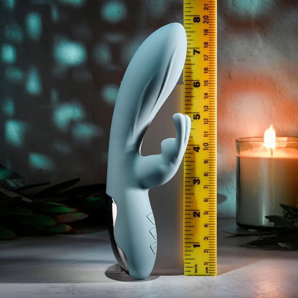 Evolved Boss Bunny in Baby Blue upright against a tape measure, reading about 8 inches