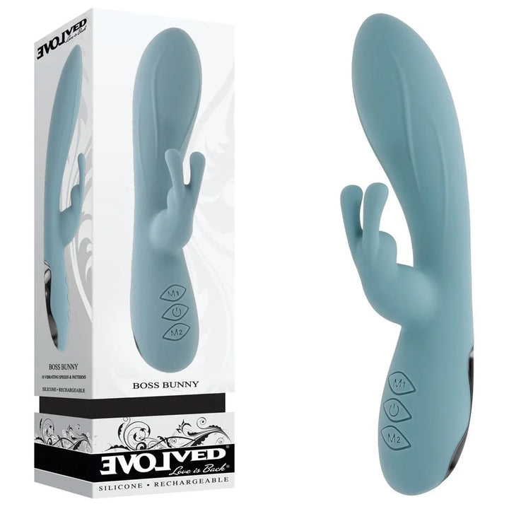 Evolved Boss Bunny rabbit vibrator in Baby Blue standing beside its Evolved retail box on white