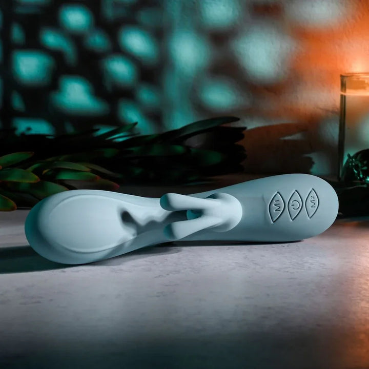 Evolved Boss Bunny in Baby Blue lying flat, close on the three control buttons in the handle