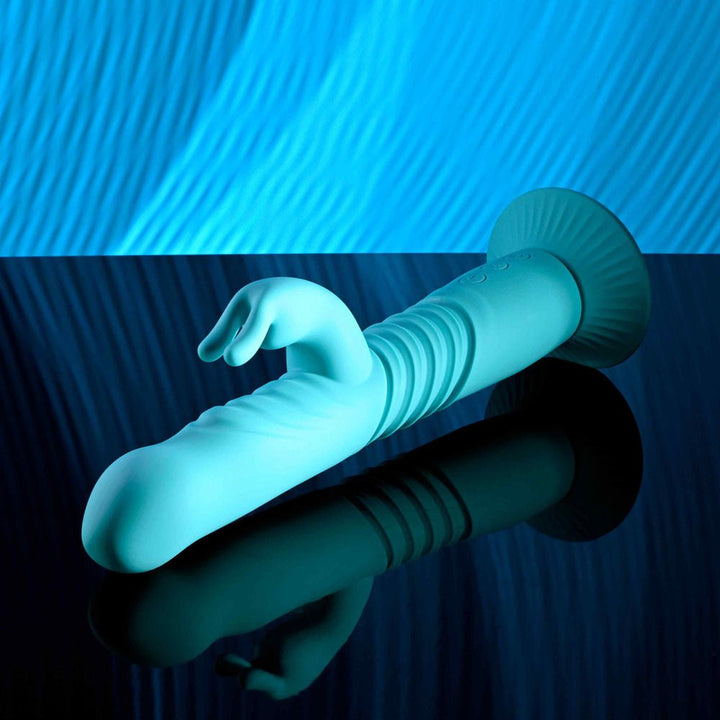 Evolved BUNNY HOP - Teal 25.1 cm USB Rechargeable Thrusting Rabbit Vibrator with Suction Base – Sex toys NZ by Naughtyhut. Discreet delivery nationwide.