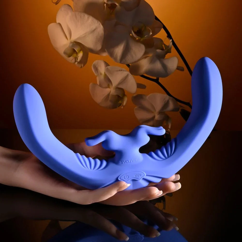 Evolved Lovebirds in periwinkle held across an open hand for scale