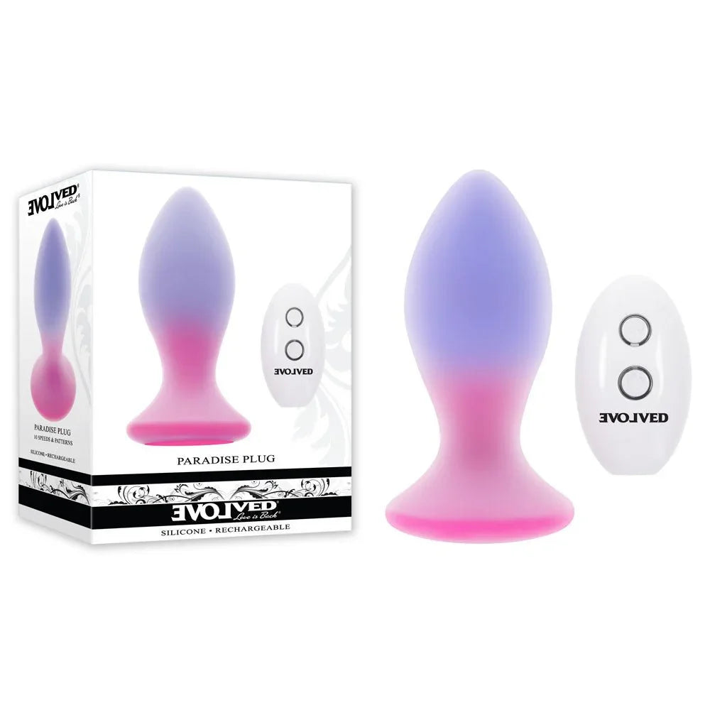 Evolved Paradise Plug in Pink/Purple with its white remote, beside the Evolved retail box on white
