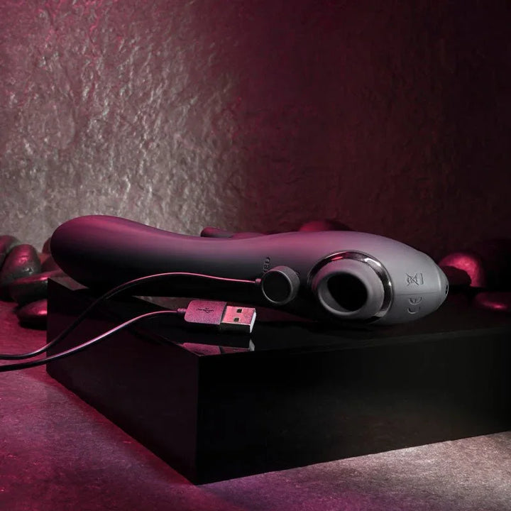 Evolved Rabbit Hole in Black on a plinth with its USB charging cable connected