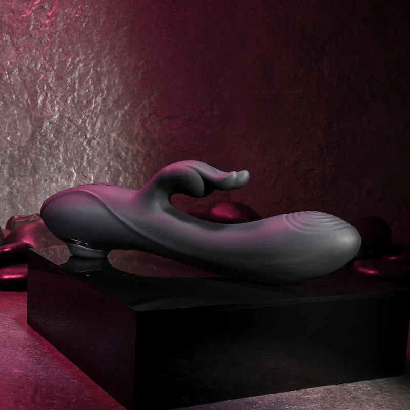 Evolved Rabbit Hole in Black lying on a black plinth, side profile with the rabbit ears raised