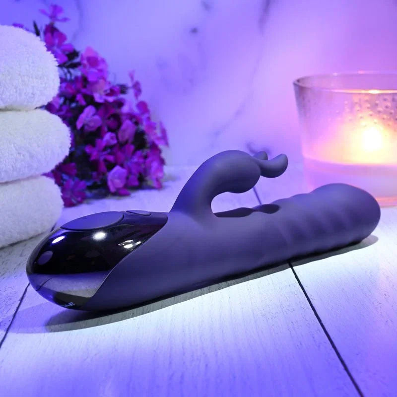 Evolved Rascally Rabbit in Purple lying flat, turned to show the black control panel in the handle