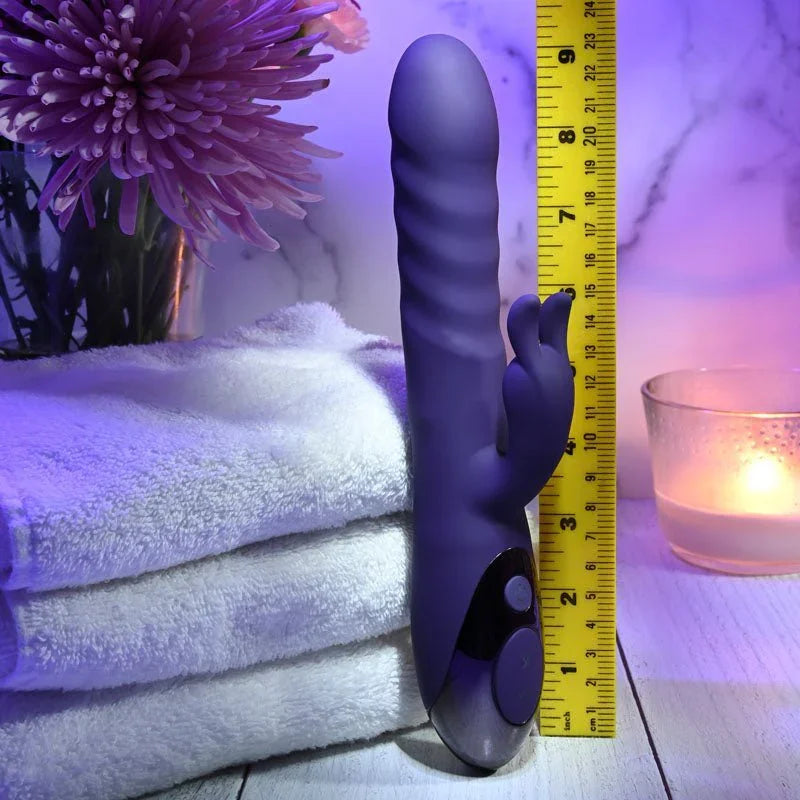 Evolved Rascally Rabbit in Purple upright beside a tape measure, reading about 9 inches