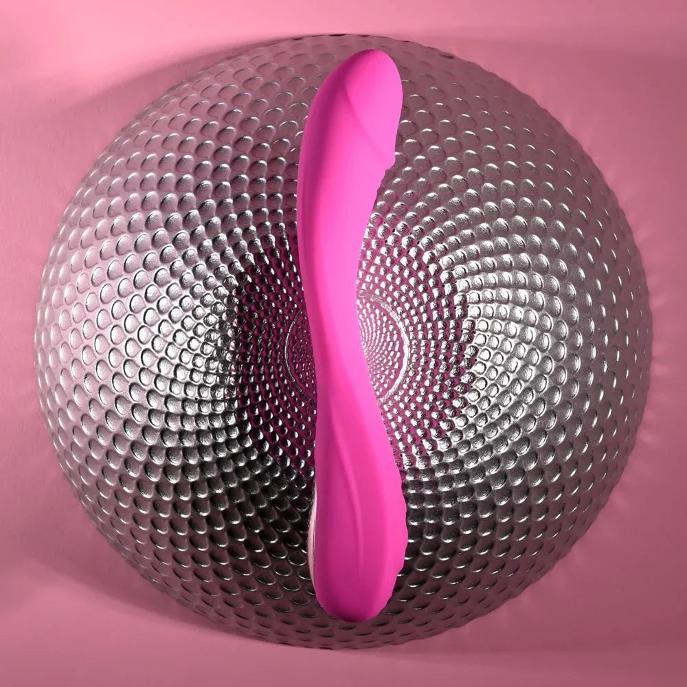 Evolved Sugar Rush in Pink standing against a silver dimpled sphere, pink backdrop