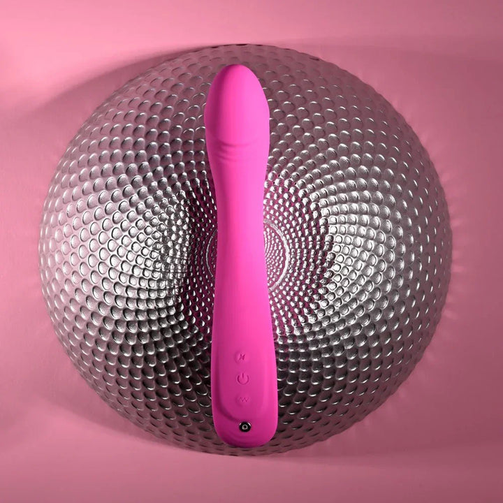 Evolved Sugar Rush in Pink standing against the silver sphere, turned to show the button panel