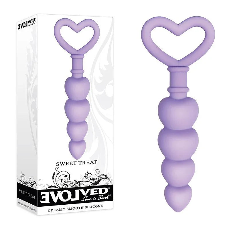 Evolved Sweet Treat beaded butt plug in Purple, upright beside its Evolved retail box