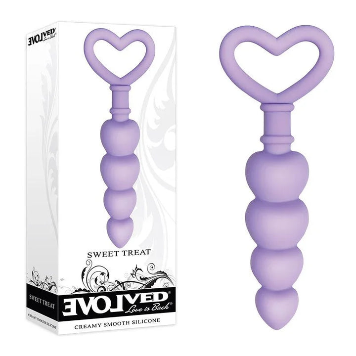 Evolved Sweet Treat beaded butt plug in Purple, upright beside its Evolved retail box
