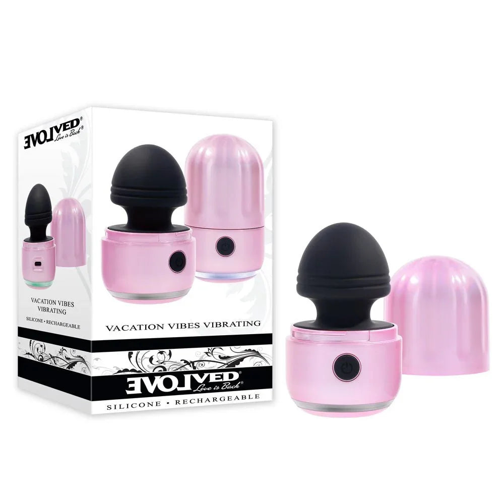 Evolved Vacation Vibes Vibrating retail box beside the pink stimulator with black head and cap removed