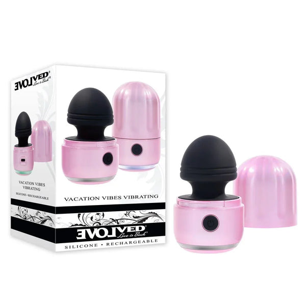 Evolved Vacation Vibes Vibrating retail box beside the pink stimulator with black head and cap removed
