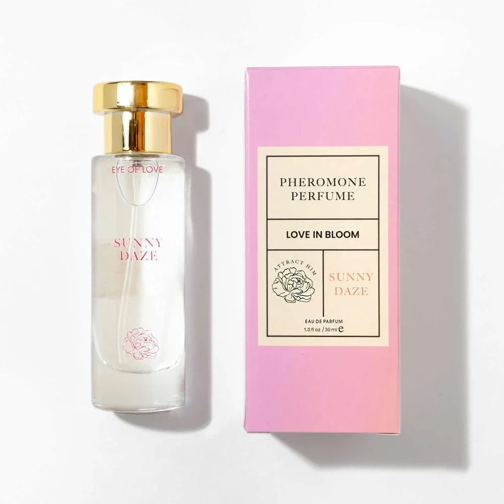 Eye Of Love Sunny Daze 30ml bottle laid flat beside its pink carton