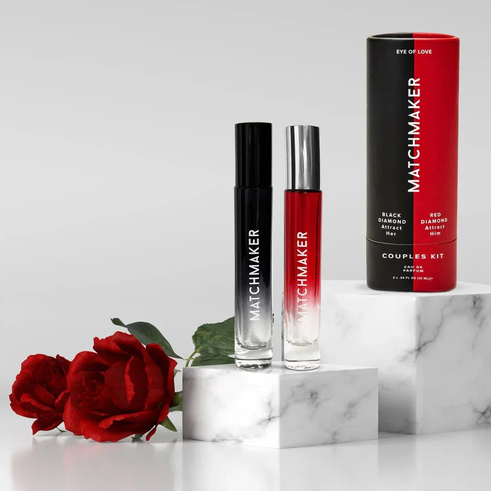 Matchmaker Couples Kit vials and two-tone tube on marble blocks with red roses