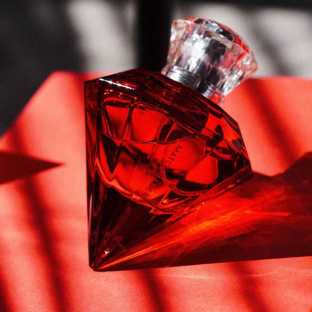 Matchmaker Red Diamond bottle standing on red fabric in dramatic red light