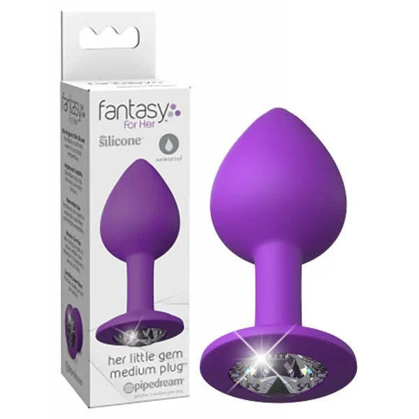 Pipedream Fantasy For Her Little Gem medium jewelled butt plug in Purple beside its box