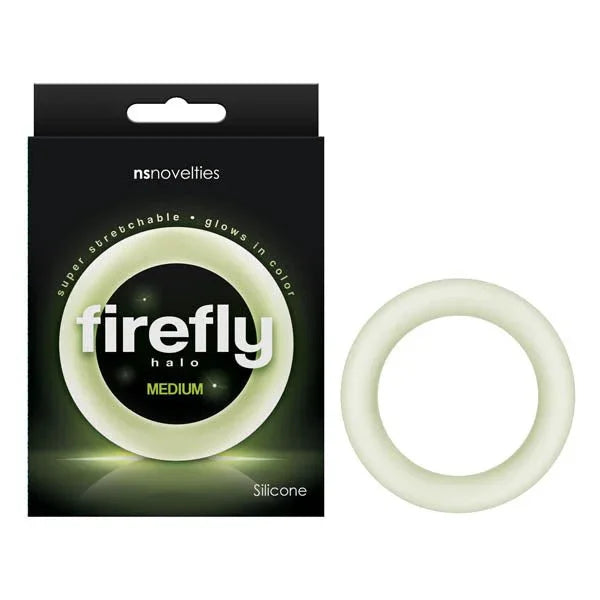 Firefly Halo cock ring in Clear, pale glow-green ring beside its black retail box