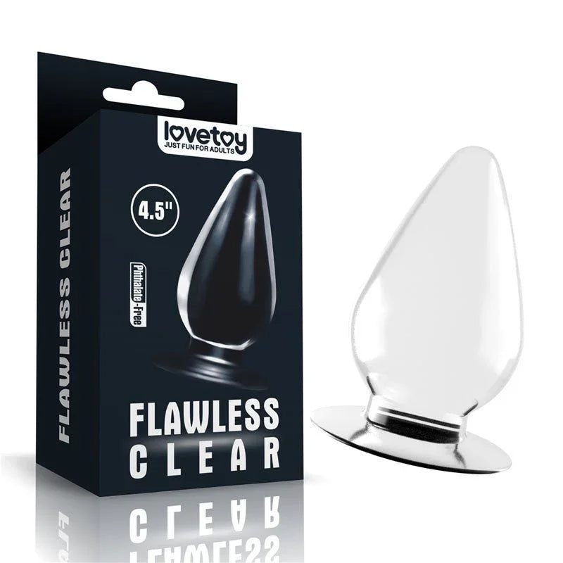 Lovetoy Flawless Clear 4.5 inch anal plug beside its black retail box, clear tapered plug