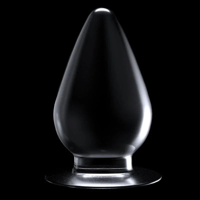 Flawless Clear anal plug standing upright on its suction base against black