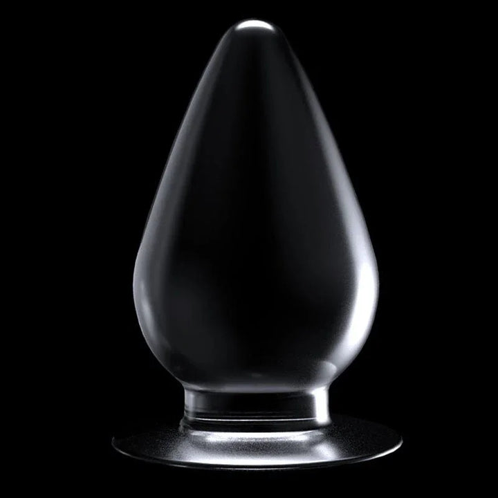 Flawless Clear anal plug standing upright on its suction base against black