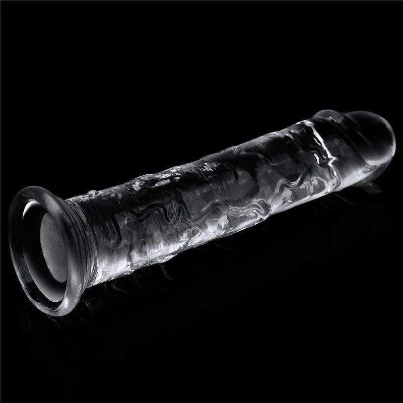 Flawless Clear 7 inch dildo on black with the hollow of the suction cup facing the camera