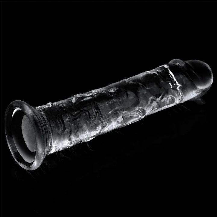 Flawless Clear 7 inch dildo on black with the hollow of the suction cup facing the camera