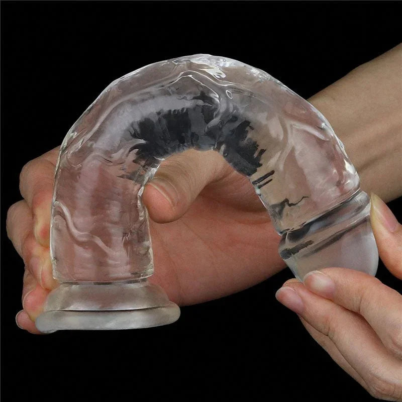 Hands bending the Flawless Clear 7 inch dildo into a U to show how far it flexes