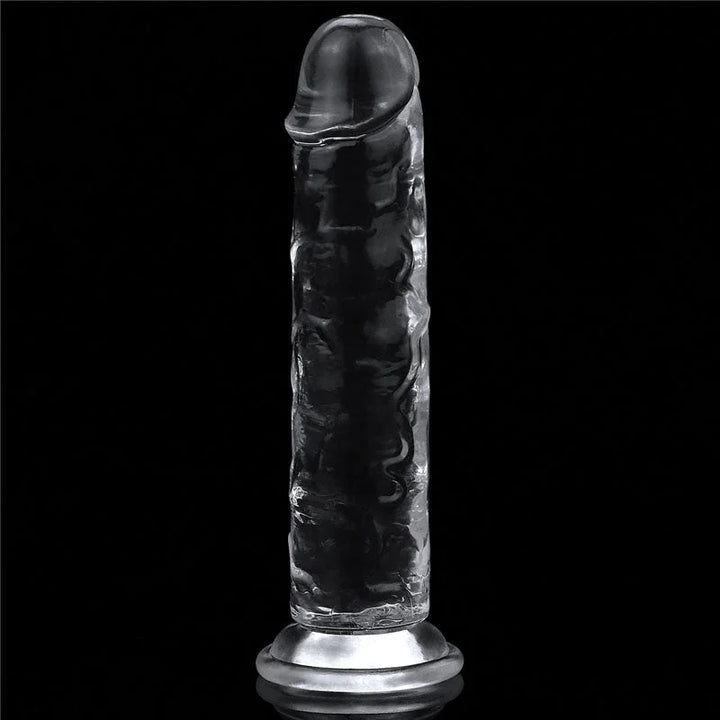 Flawless Clear 7 inch dildo standing upright on its suction base against black