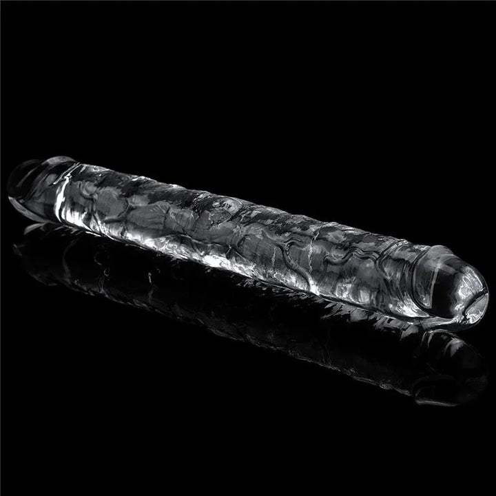 Flawless Clear double dildo at an angle on black, light through the transparent shaft