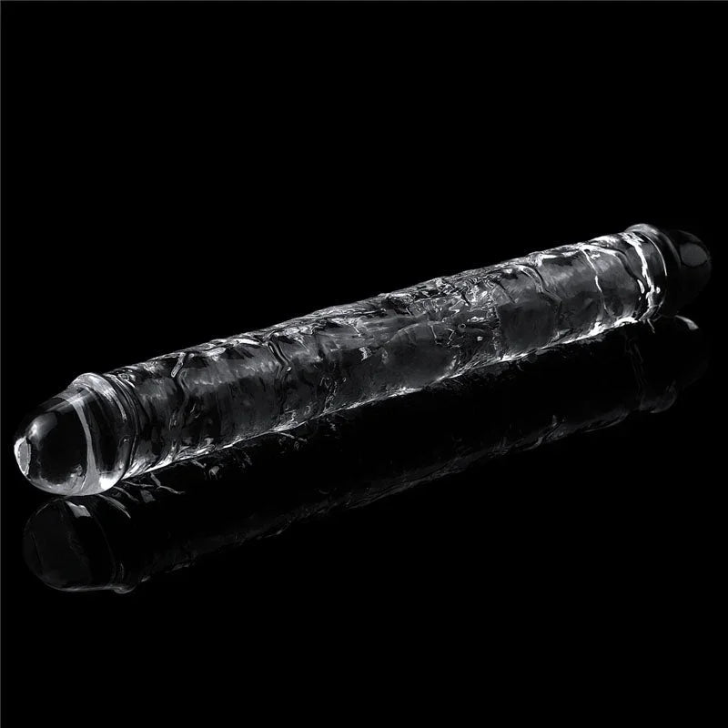 Flawless Clear double dildo lying diagonally, reflection on the glossy black surface