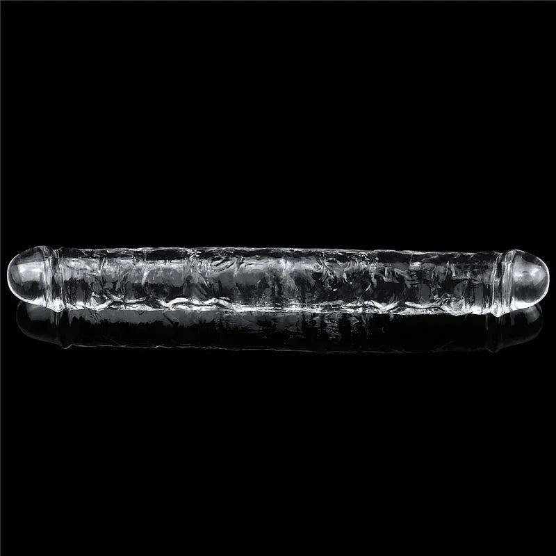 Flawless Clear double dildo lying horizontally on black, a head at each end