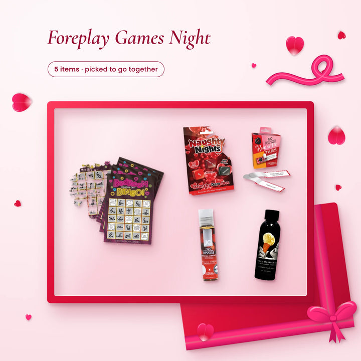 Foreplay Games Night: bingo scratch cards, dare dice, Romantic Tabs, strawberry lube and vanilla massage oil on pink