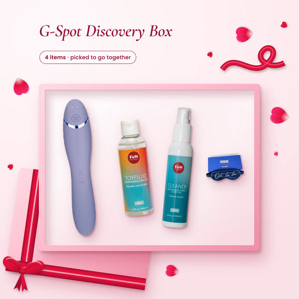 G-Spot Discovery Box: a lilac Womanizer OG, Fun Factory lube and cleaner, and a navy silk blindfold on pink