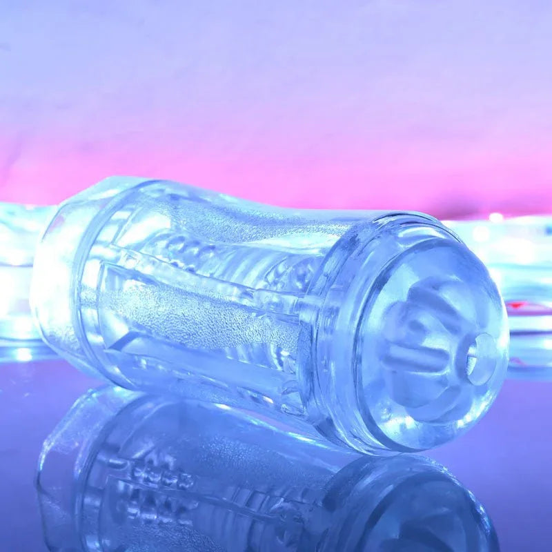 Gender X Double Fantasy stroker in Clear angled to show the opposite textured end