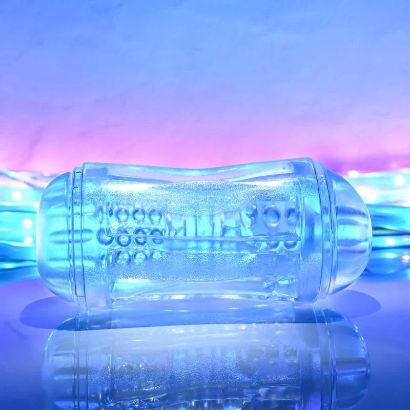 Gender X Double Fantasy stroker in Clear on a mirrored surface, side view