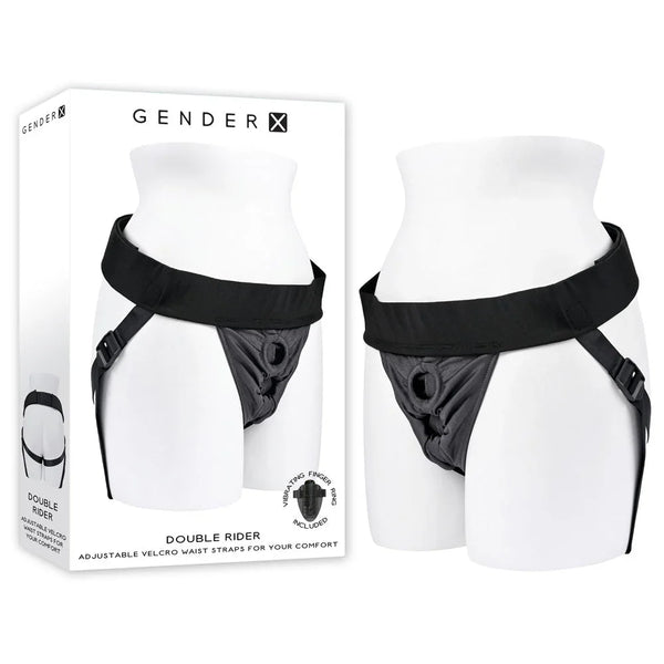 Gender X Double Rider harness in Black worn on a mannequin torso, beside its retail box