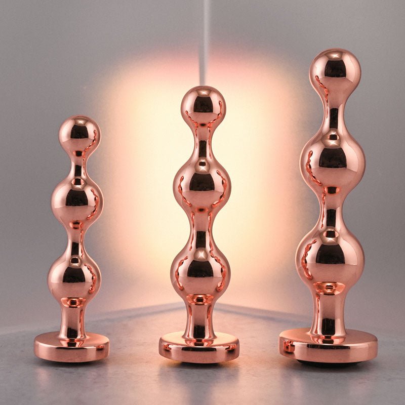 Buy Gender X GOLD DIGGER SET - Rose Gold Metallic Butt Plugs - Set of 3 Sizes – Naughtyhut NZ sex toys online. Discreet delivery & top brands.