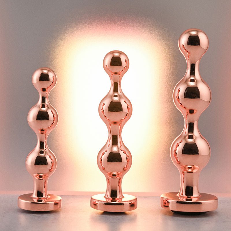 Buy Gender X GOLD DIGGER SET - Rose Gold Metallic Butt Plugs - Set of 3 Sizes – Naughtyhut NZ sex toys online. Discreet delivery & top brands.