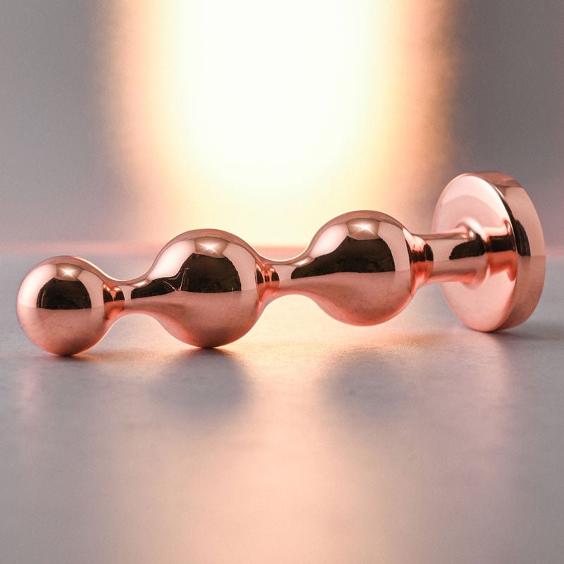 Buy Gender X GOLD DIGGER SMALL - Rose Gold Small Butt Plug with Black Gem Base – Naughtyhut NZ sex toys online. Discreet delivery & top brands.