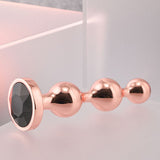 Buy Gender X GOLD DIGGER SMALL - Rose Gold Small Butt Plug with Black Gem Base – Naughtyhut NZ sex toys online. Discreet delivery & top brands.