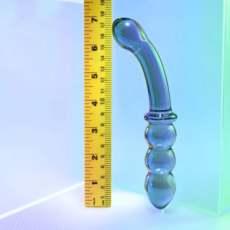 Gender X Lustrous Galaxy Wand upright beside a tape measure showing its length