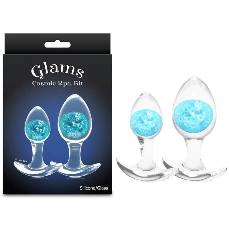 Glams Cosmic 2pc kit, two clear glass plugs with blue glitter gems beside the Glams box