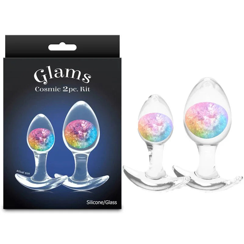 Glams Cosmic 2pc kit, two clear glass plugs with rainbow glitter gems beside the Glams box
