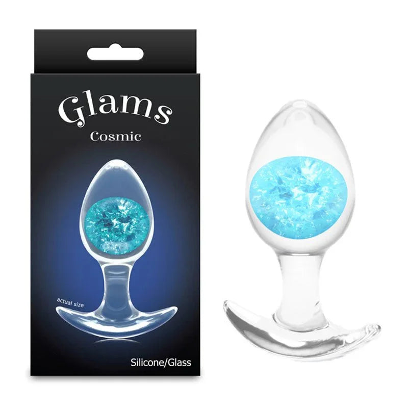 Glams Cosmic medium glass butt plug with a blue glitter gem, beside its Glams Cosmic box
