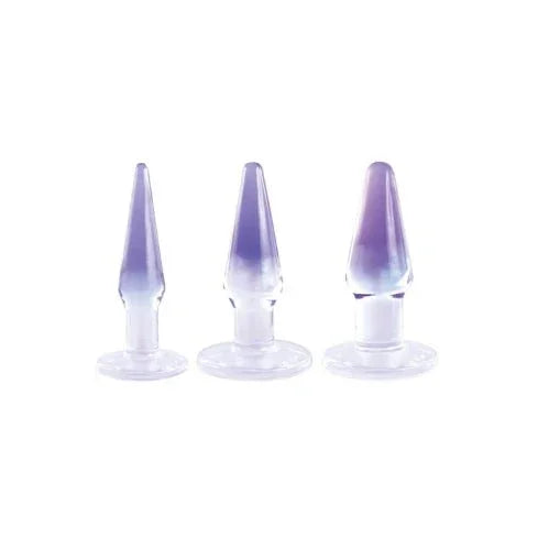 Glitzy Trainer anal plug kit, three clear PVC plugs with purple tips lined up by size