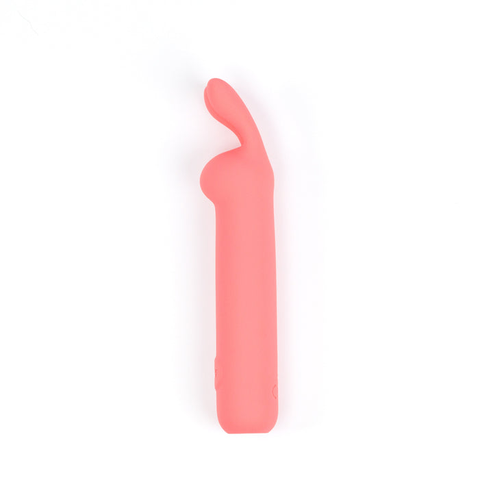 ILY The Rabbit coral pink vibrator side profile showing the curved flexible ears