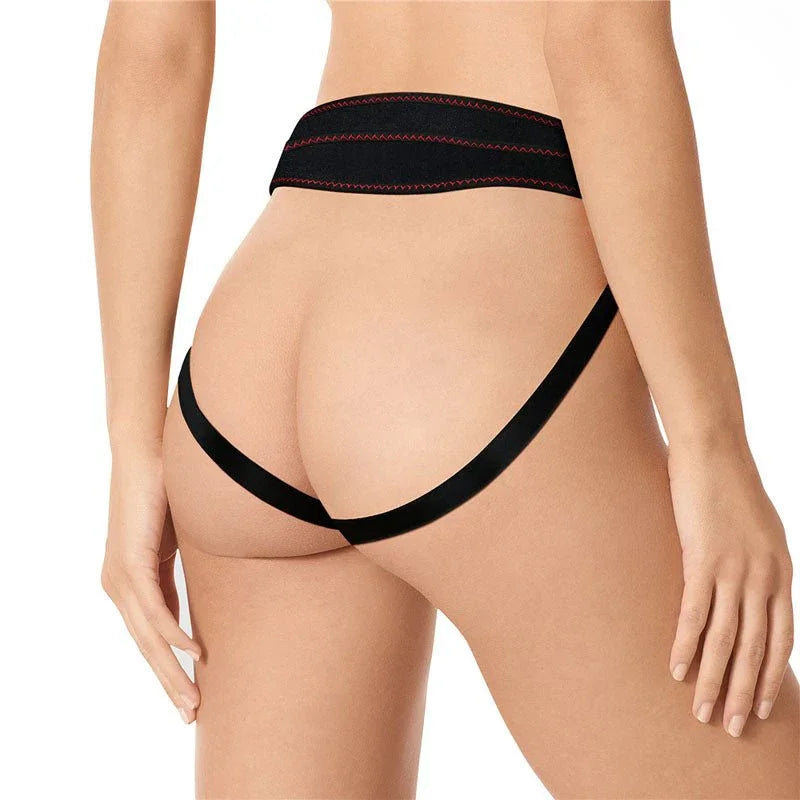 Rear view of a model wearing the black Ingen harness, waistband and thigh straps across the hips