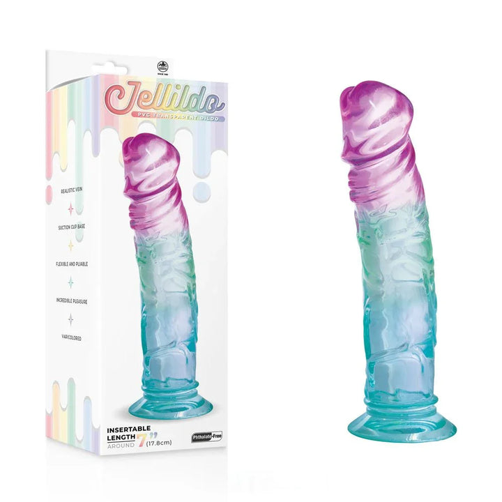 Jellido 18 cm dildo, purple-to-teal transparent PVC, beside its rainbow drip box