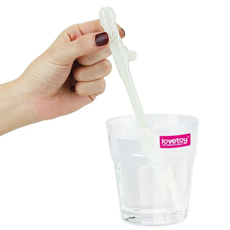 Hand lowering a willy straw into a short glass of clear drink